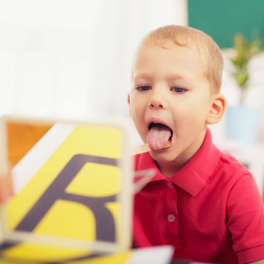 Speech therapist working with a child